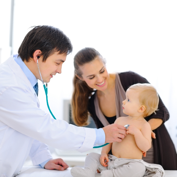 A wall mural depicting a serene tropical beach with turquoise water, a thatched-roof bungalow, palm trees, and distant mountains.